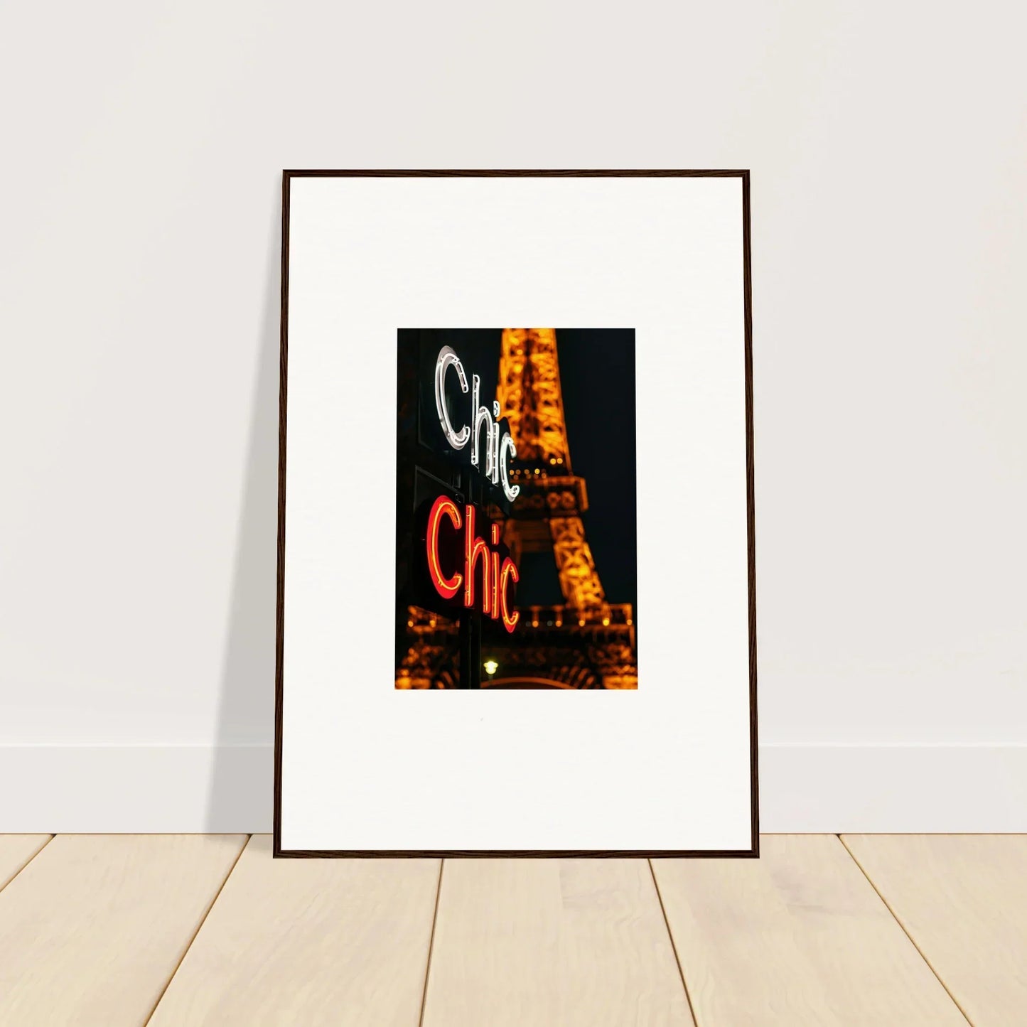 Framed wall art of the Eiffel Tower with C’est Chic for stylish room decoration