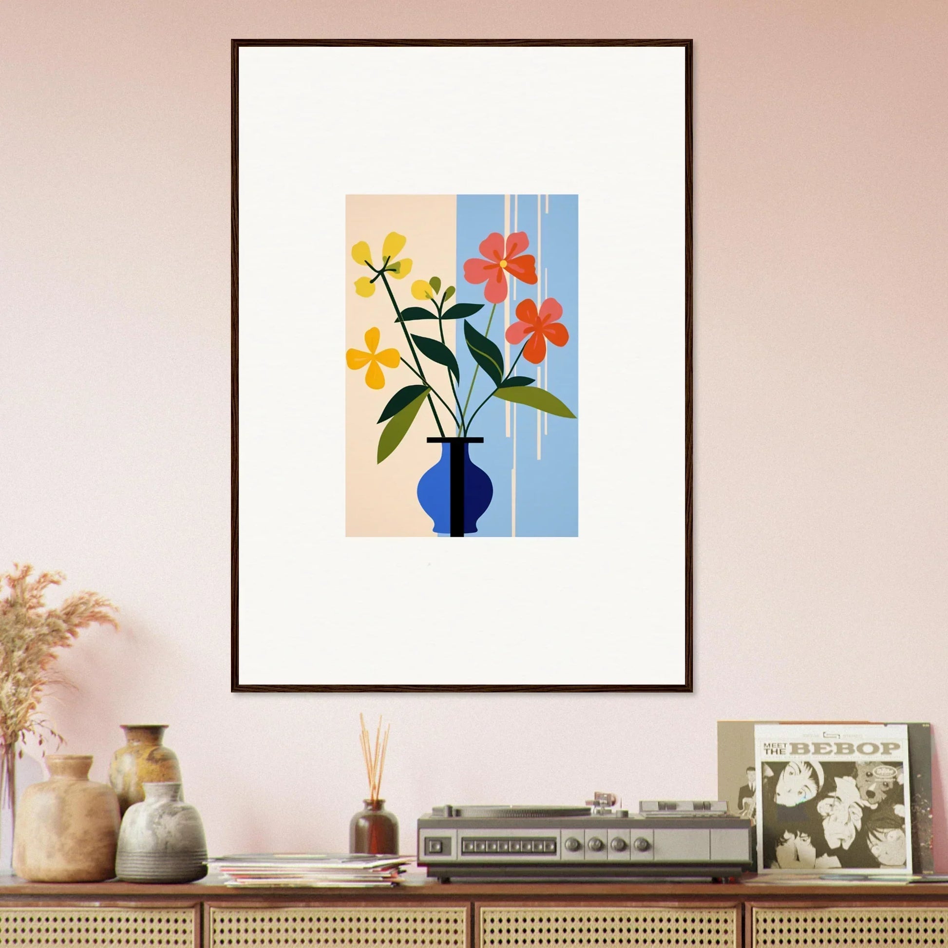 Framed wall art of colorful flowers in a blue vase for vibrant room decor