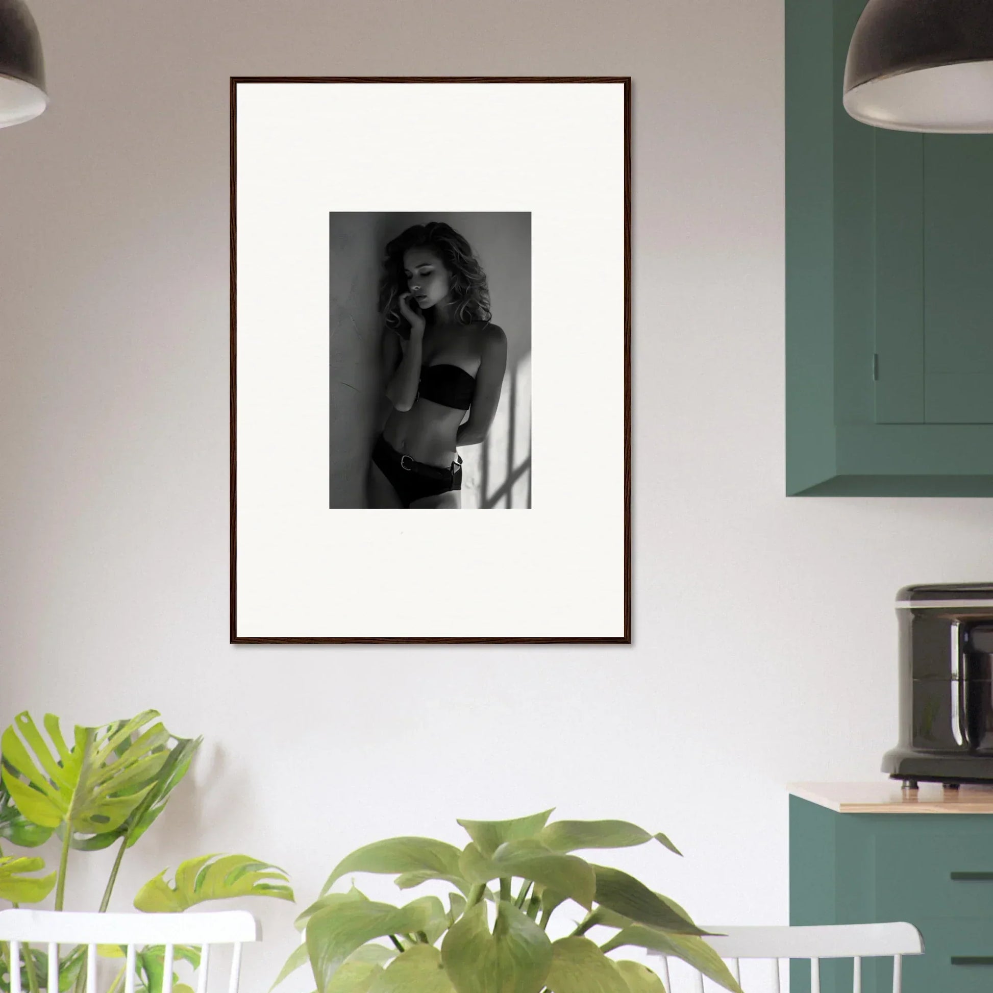 Framed black and white photograph of a woman in lingerie.