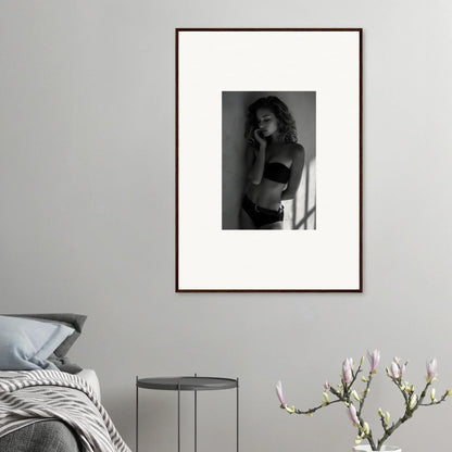 Framed black and white photograph of a woman in a crop top.