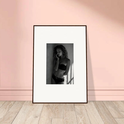 Framed black and white photograph of a woman in lingerie.