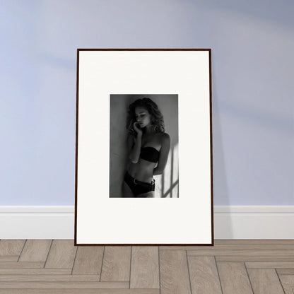 Framed black and white photograph of a woman in lingerie.