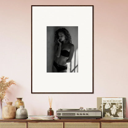 Framed black and white photograph of a woman in lingerie.