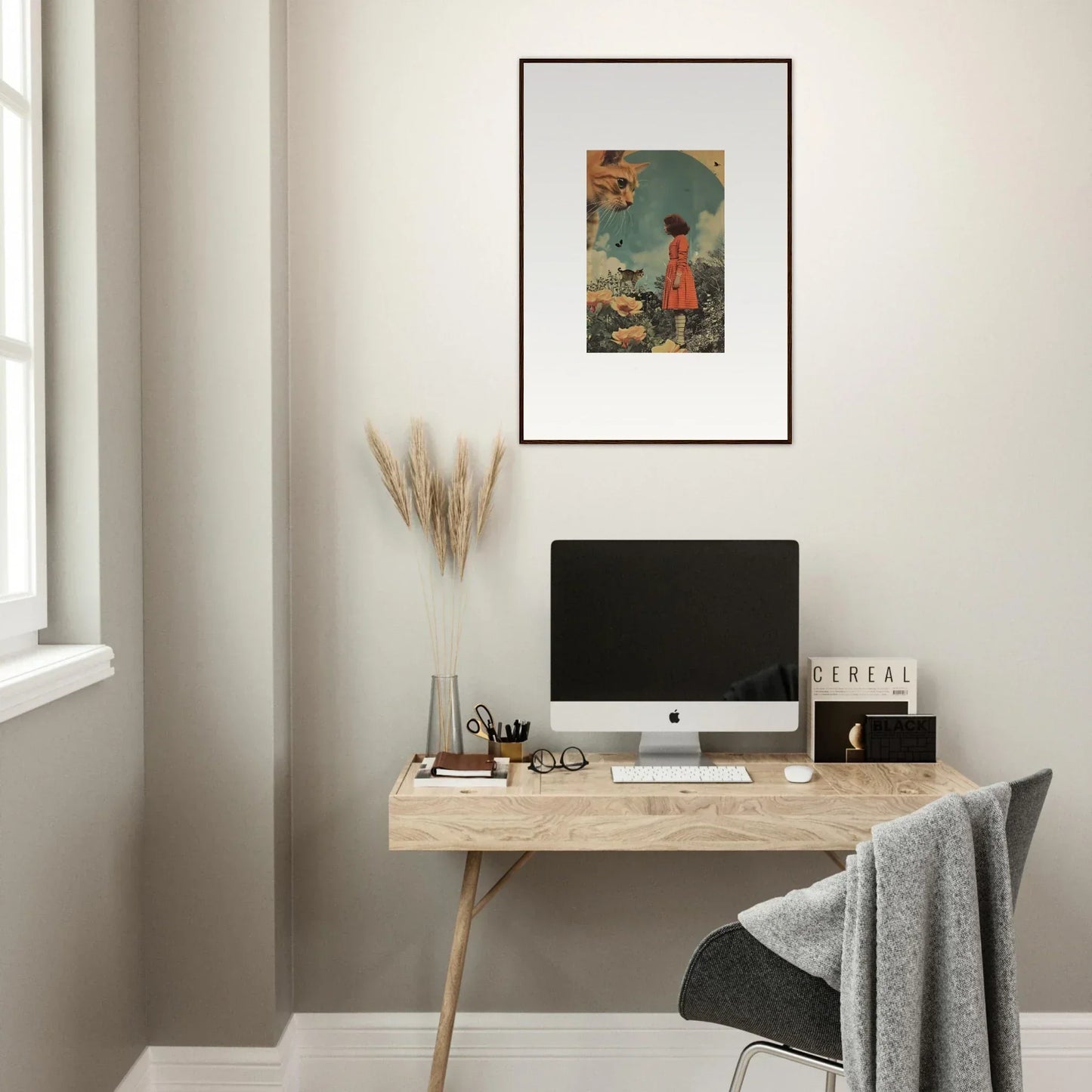 Minimalist wooden desk with computer monitor and framed wall art for elegant room decor