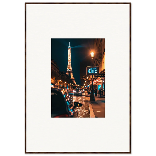 Framed wall art of a Parisian street at night with the Eiffel Tower illuminated