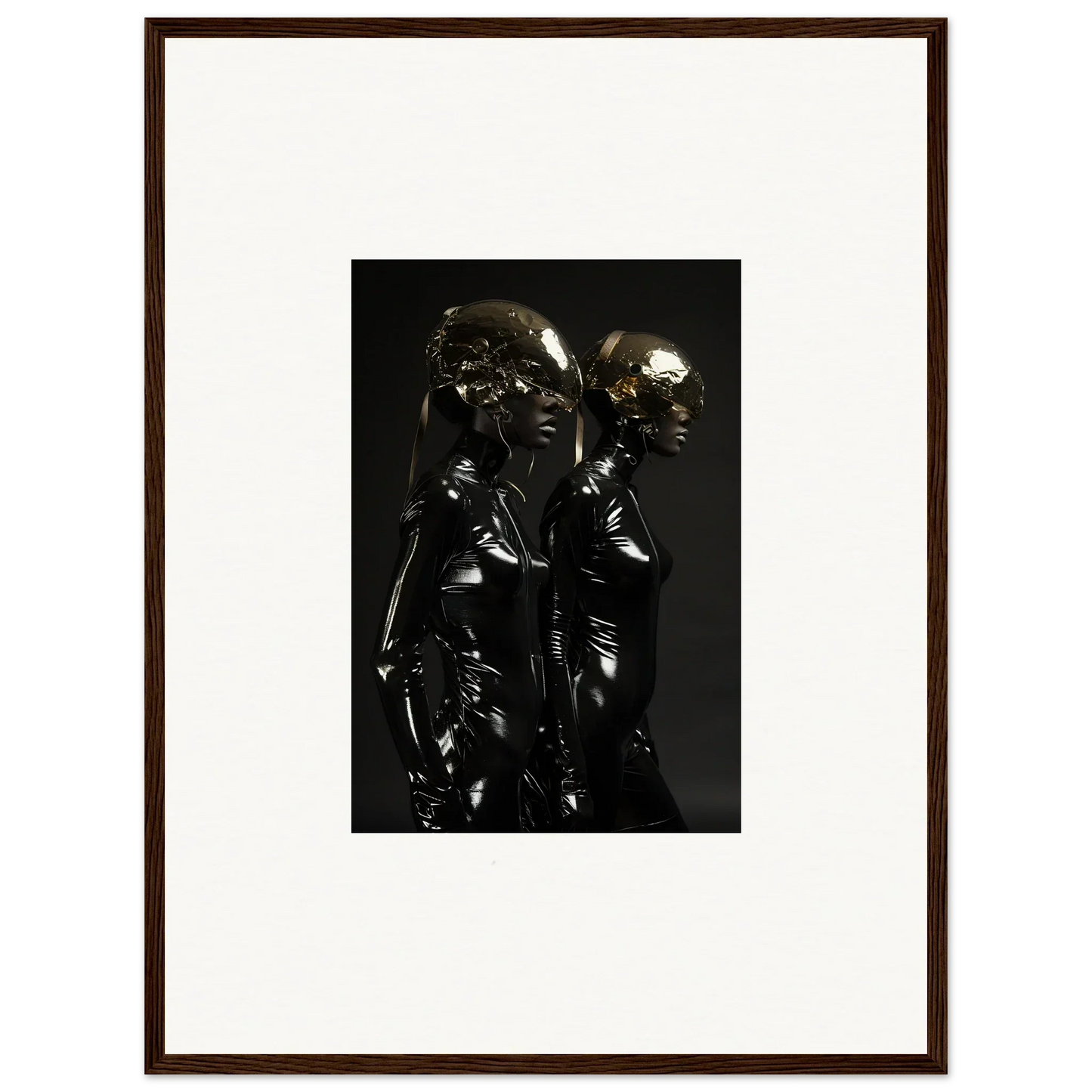 Dark metallic sculpture depicting two stylized human figures standing close together.