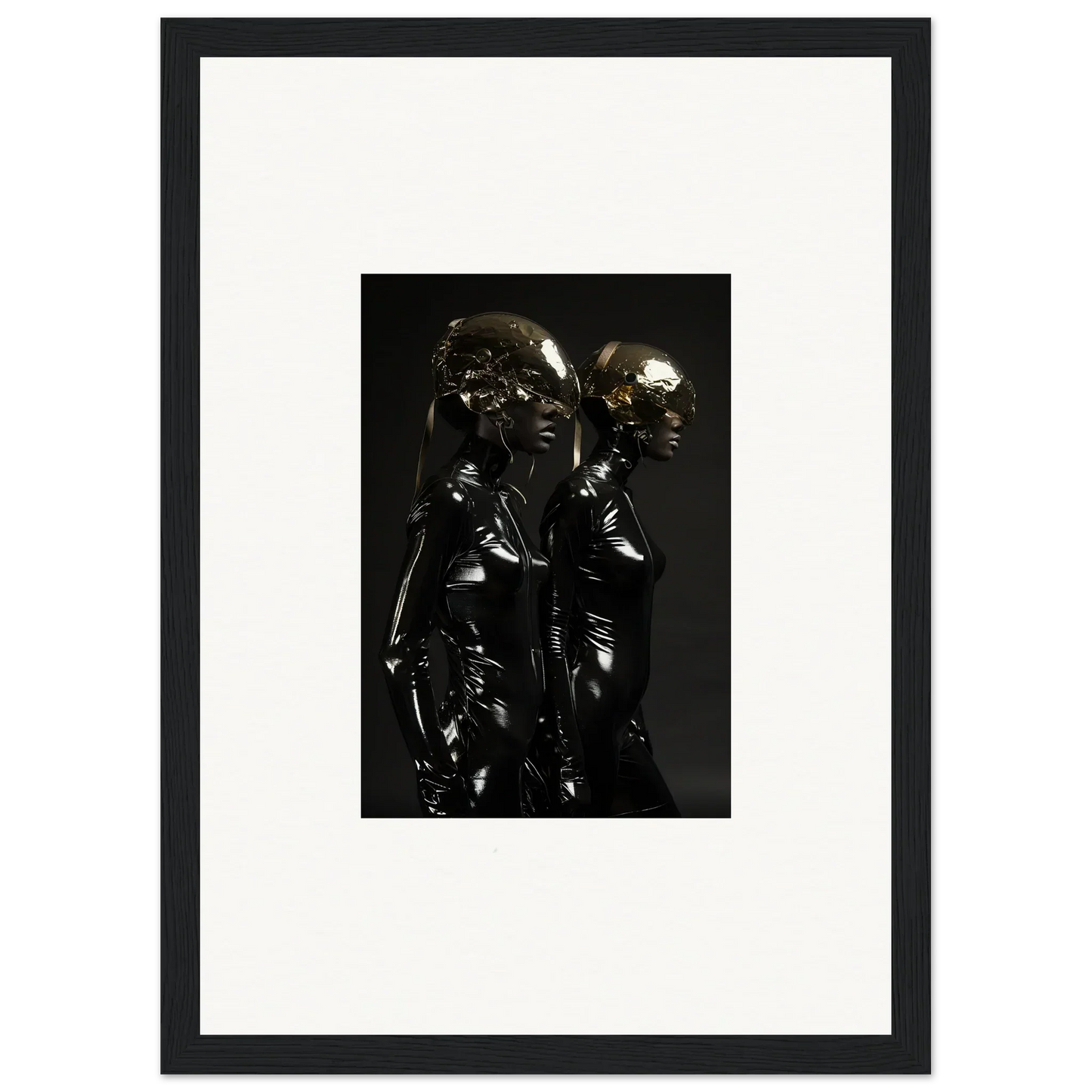 Metallic sculpture of two intertwined figures with reflective surfaces.