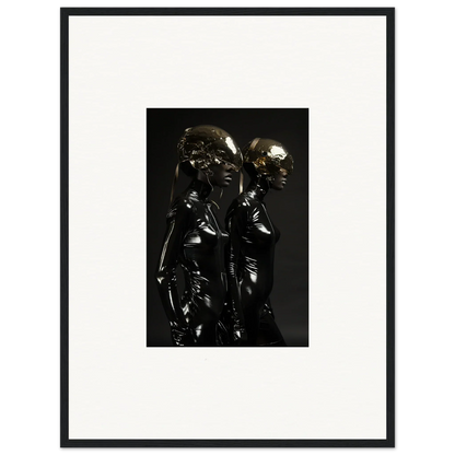 Metallic sculpture depicting two stylized human figures standing close together.