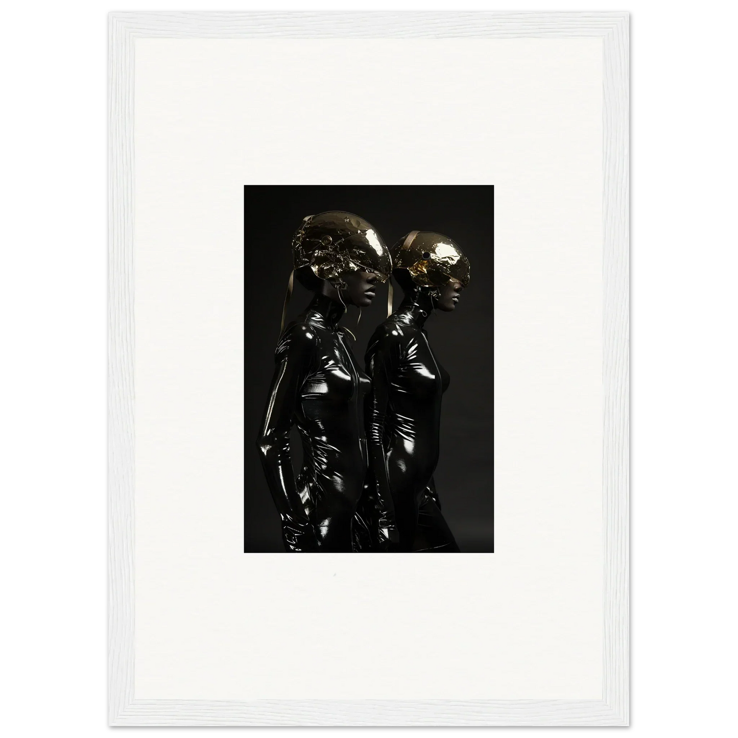 Metallic sculpture of two intertwined figures with reflective surfaces.