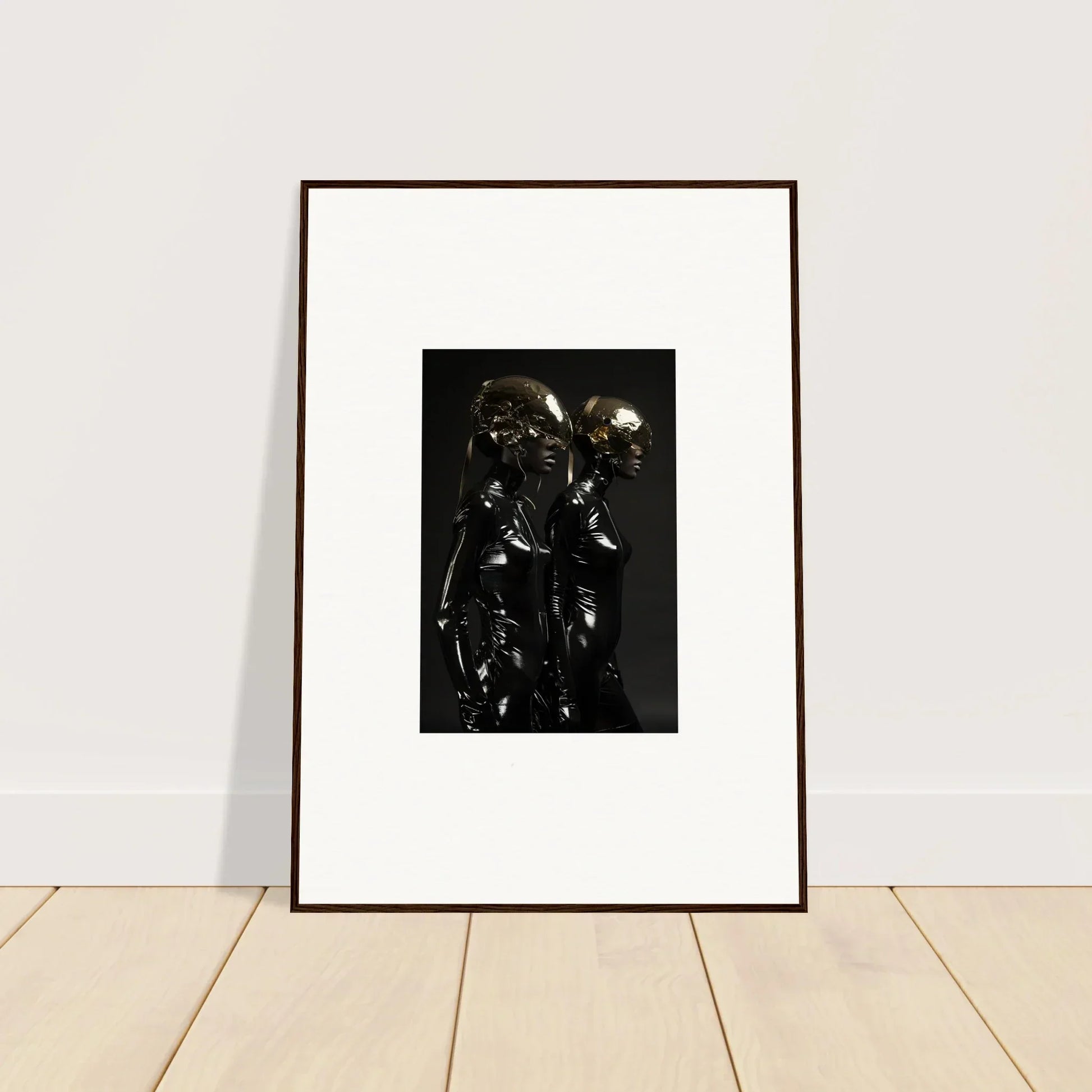 Framed photograph of two shiny, metallic humanoid figures.