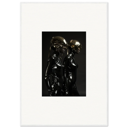 Dark metallic sculpture depicting two closely positioned figures.