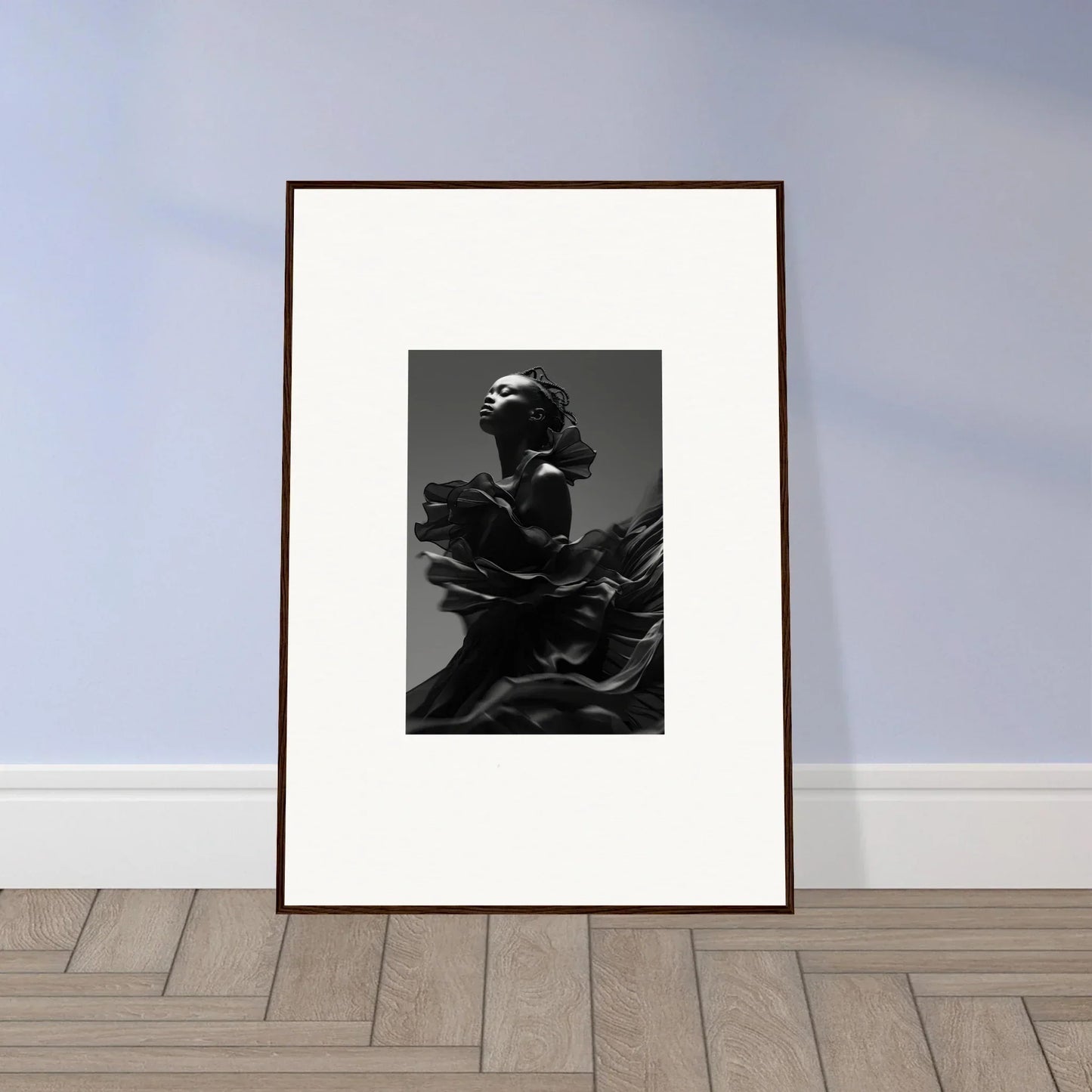 Framed black and white photograph of a figure emerging from billowing fabric.