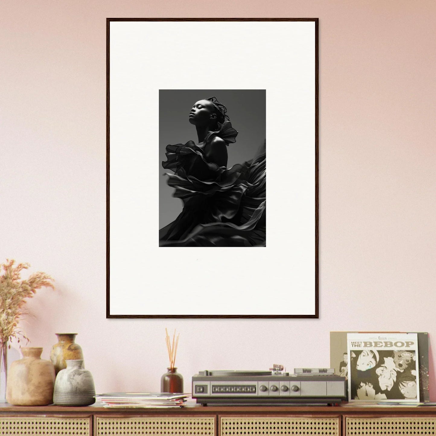 Framed black and white photograph of a sculptural figure.