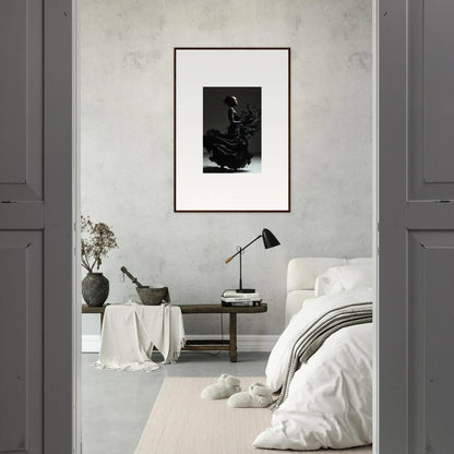 Minimalist bedroom with a framed black and white photograph as the focal point.