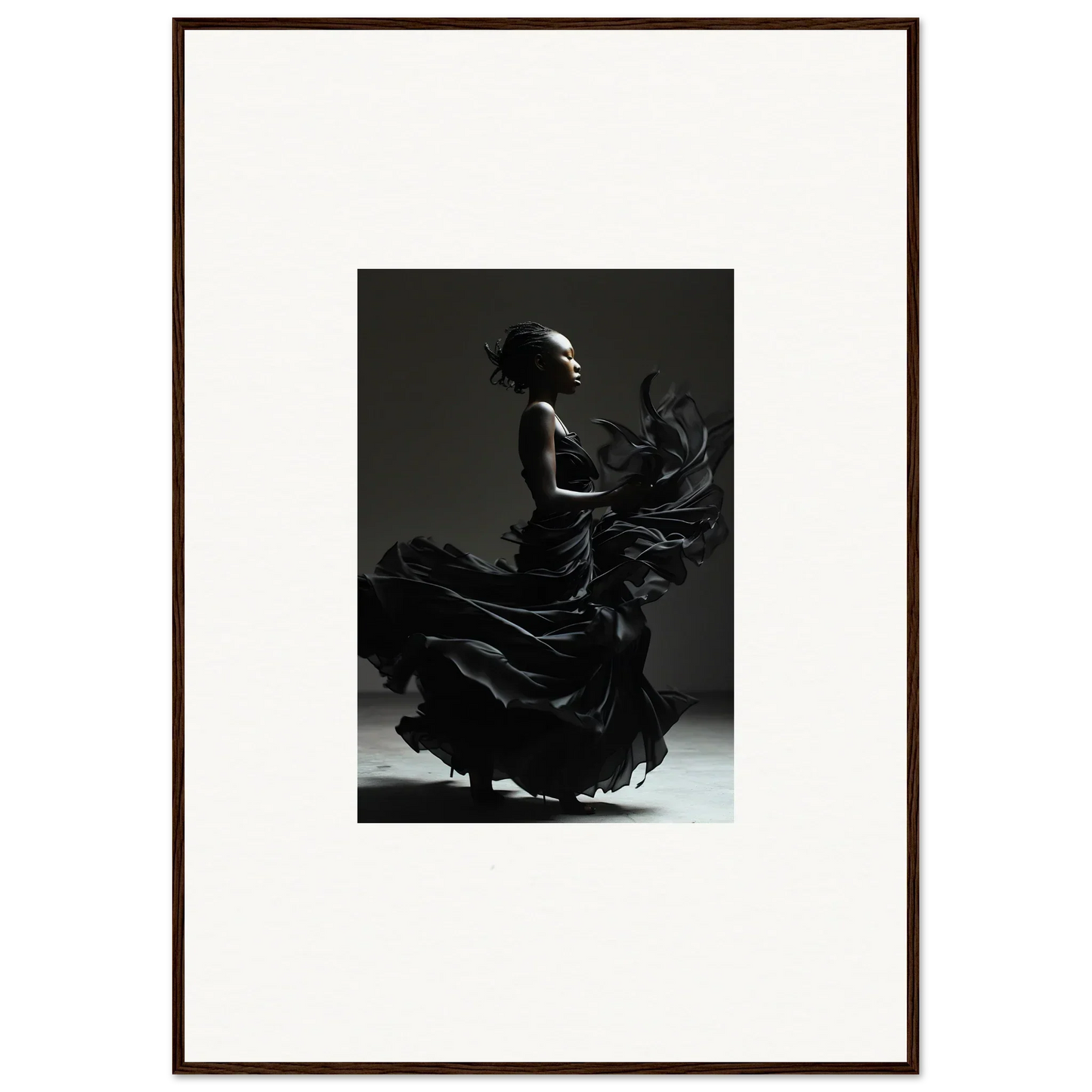 Silhouette of a flamenco dancer in a flowing dress, captured mid-motion.