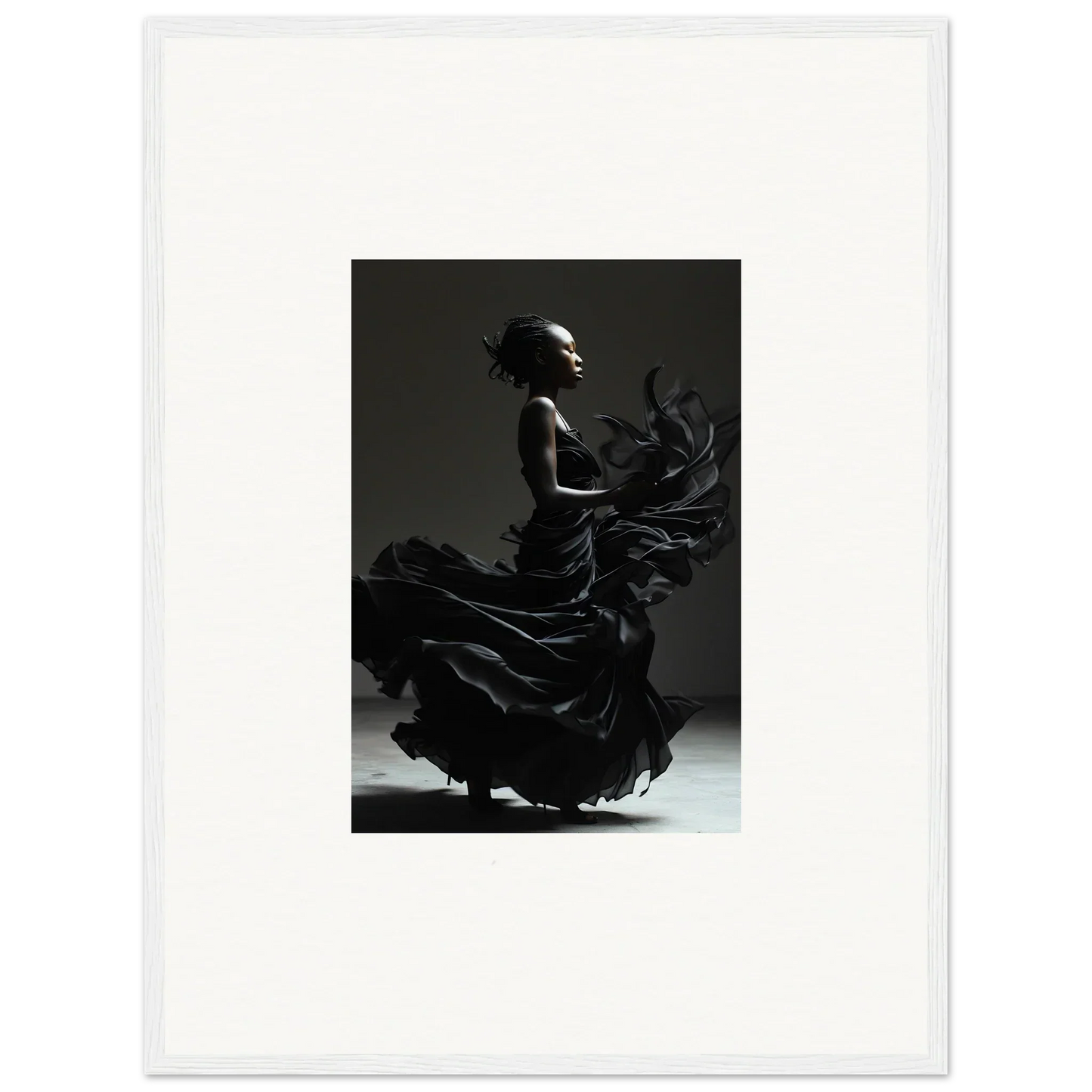 Silhouette of a flamenco dancer in a swirling dress.