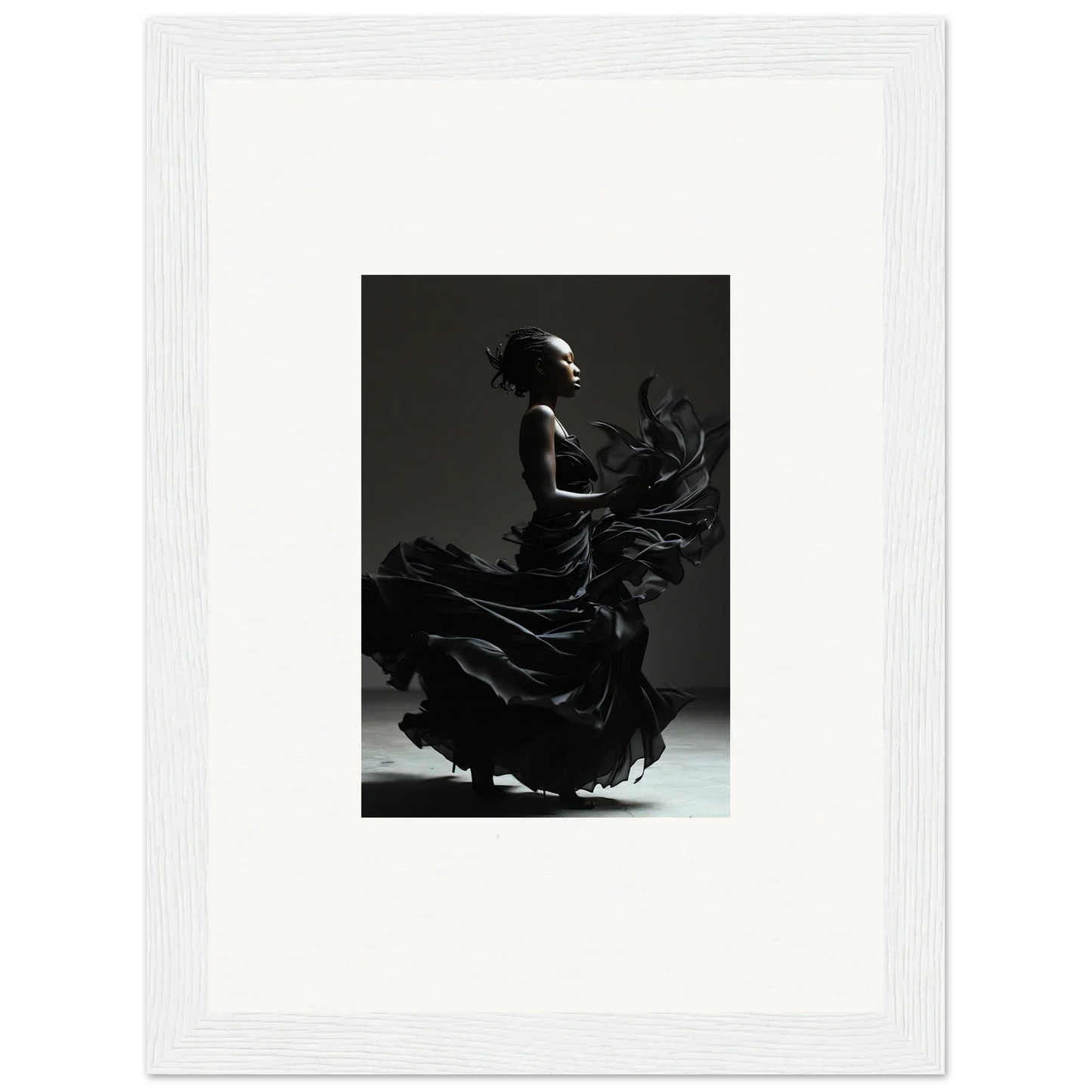 Silhouette of a flamenco dancer in dramatic motion.