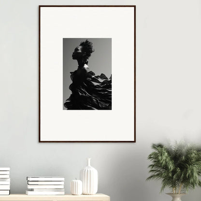 Framed black and white artwork depicting a silhouette with a tree-like shape emerging from its head.