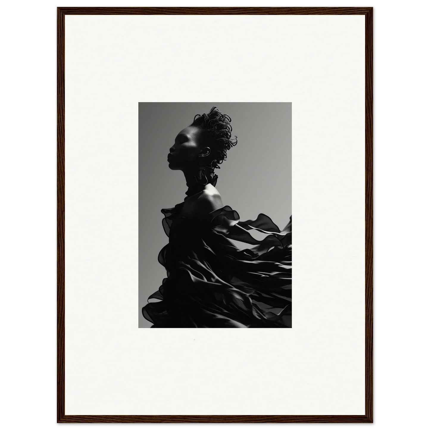 Silhouette of a person with flowing, wind-swept fabric.