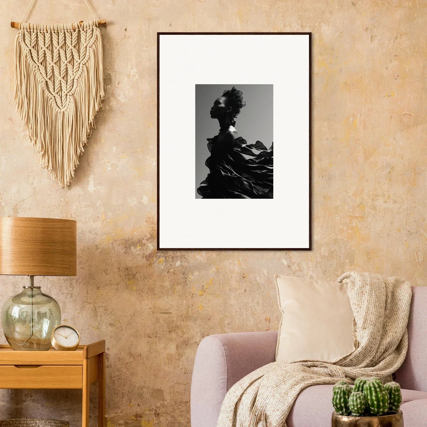 Framed black and white photograph of a silhouetted figure with an elaborate hairstyle.