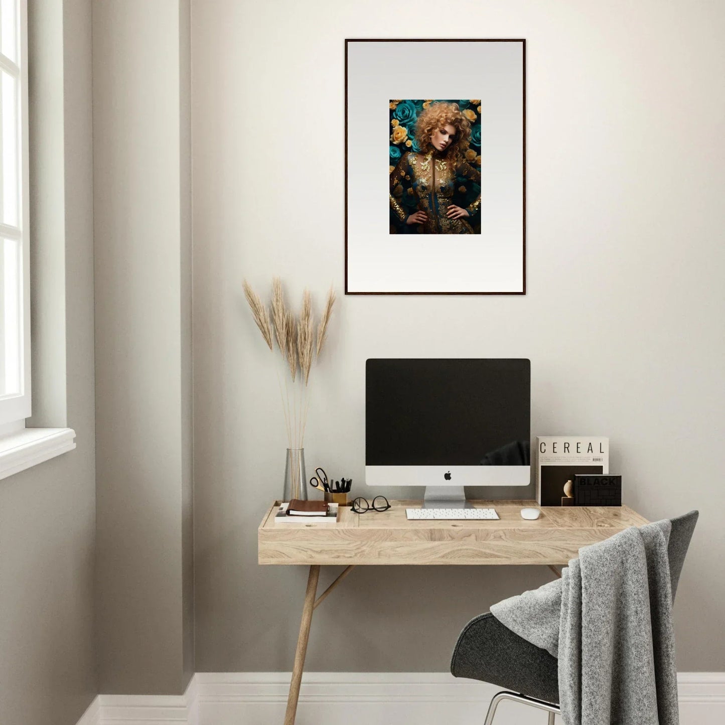 Framed artwork depicting a dog in a Renaissance-style portrait hanging above a desk.