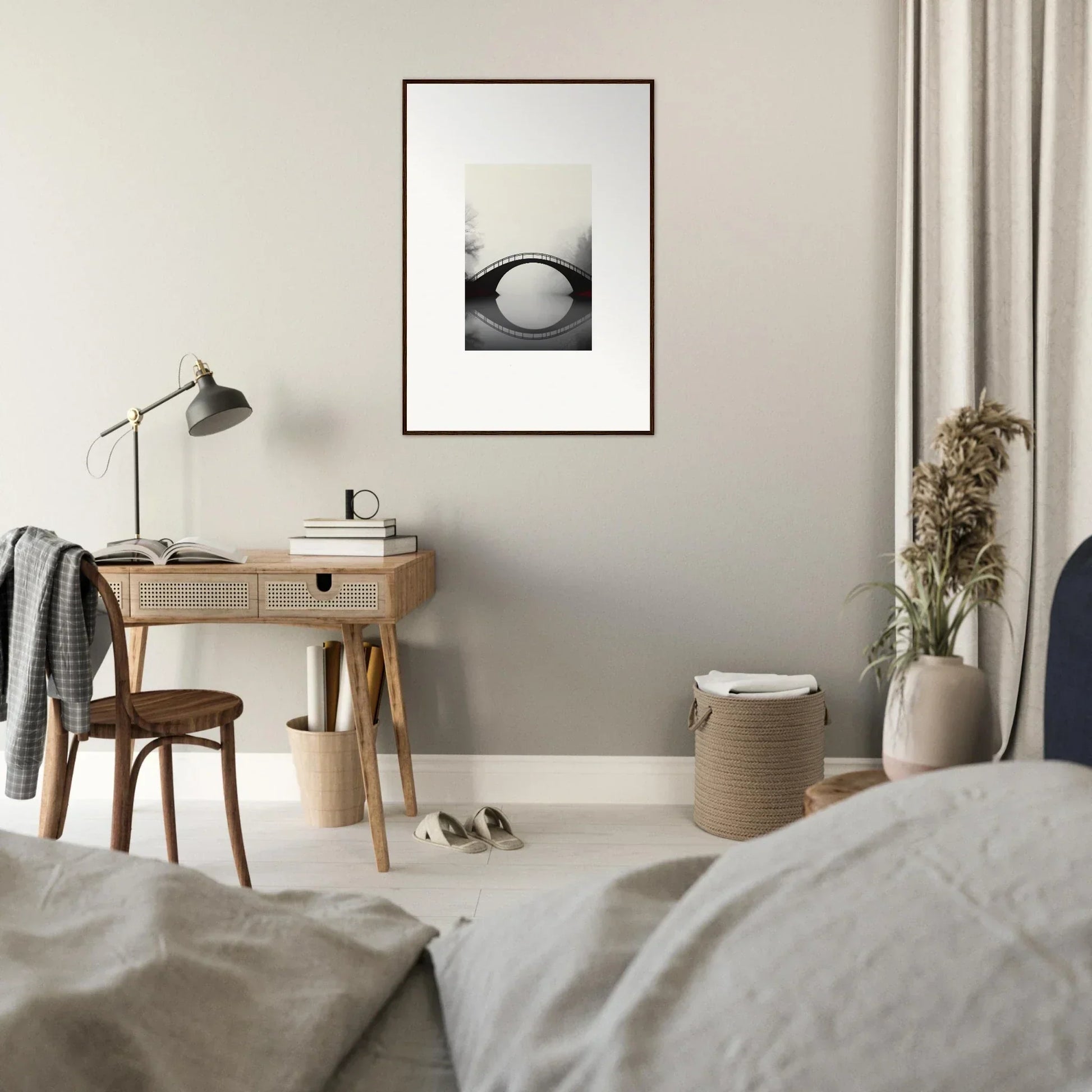 Minimalist bedroom with wooden desk, lamp, and a canvas print for room decoration