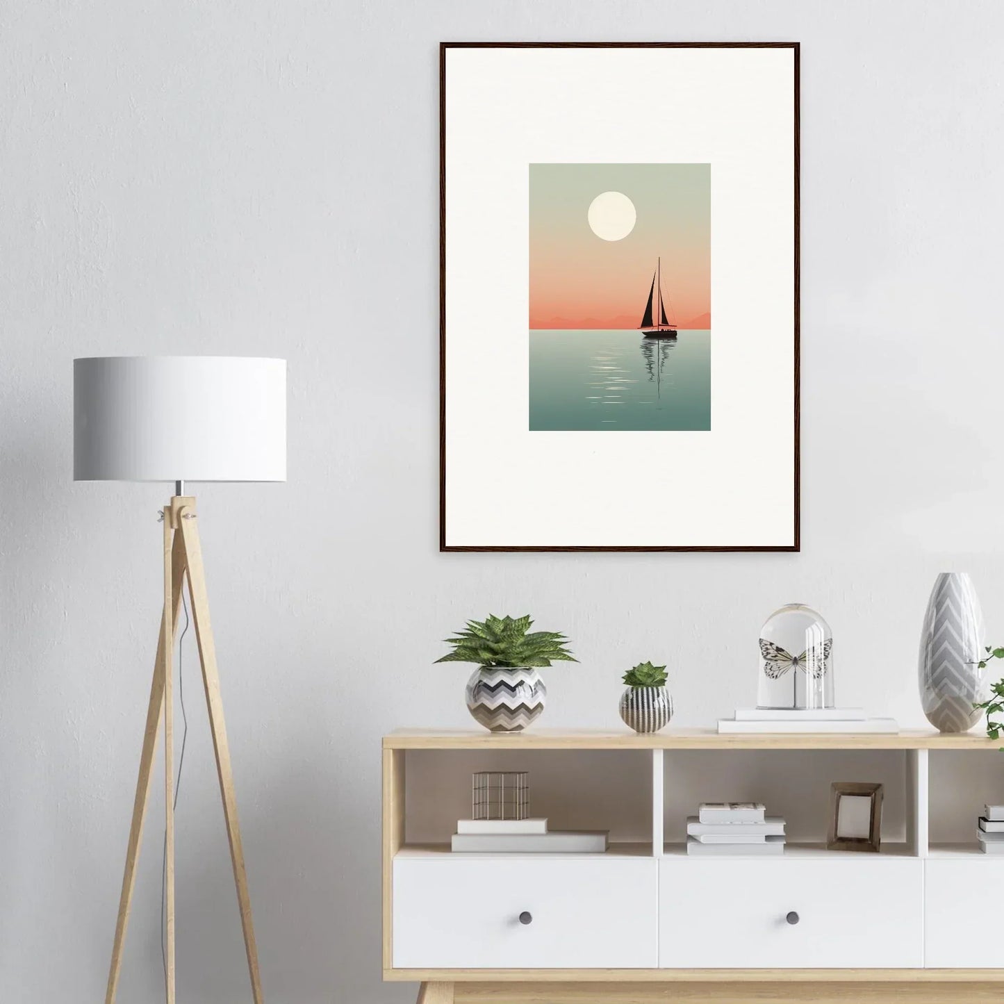 Framed canvas print of nautical harmonies with a sailboat under a full moon at sunset