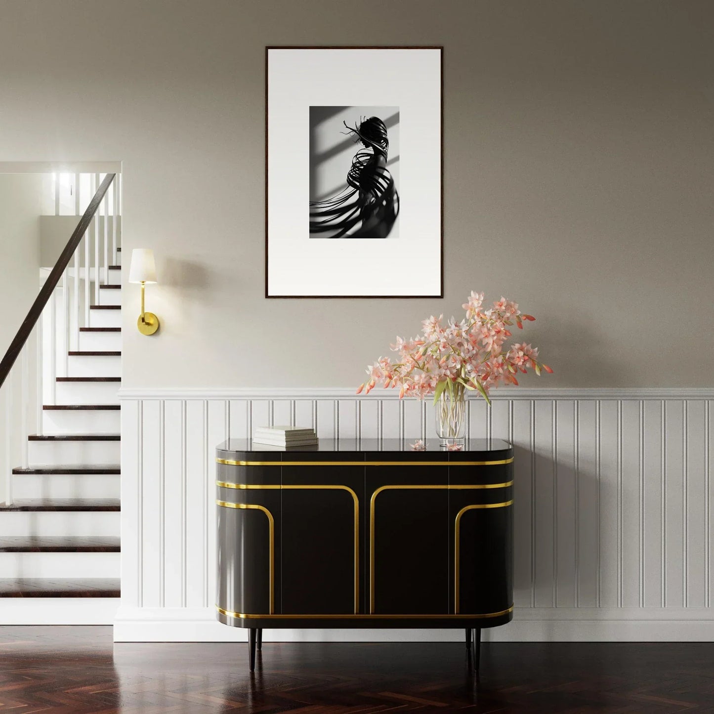 Elegant entryway with a black and gold console table and a stunning canvas print