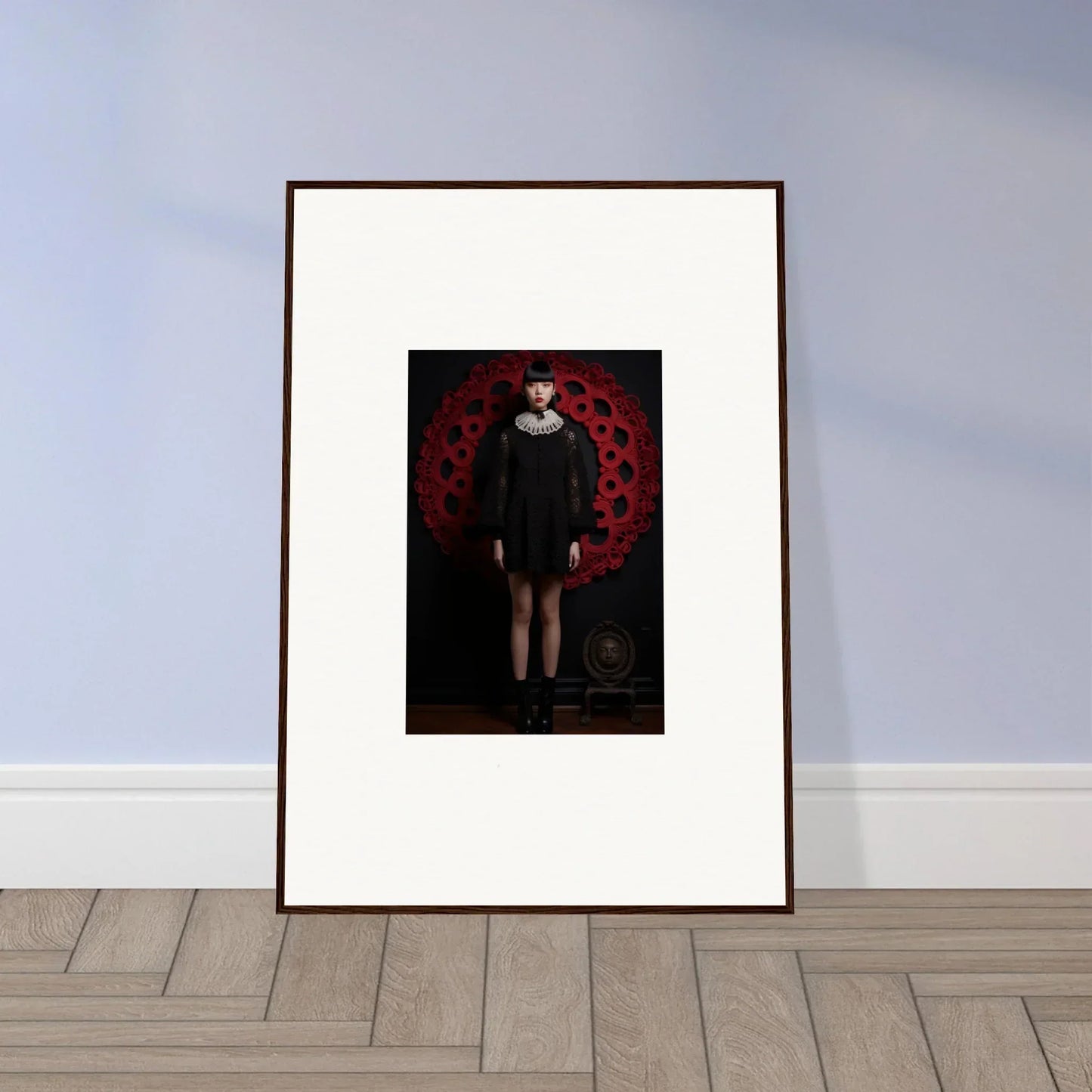 Framed wall art of a dark figure in red, part of Ecstasy Velvet Corsetry special edition art