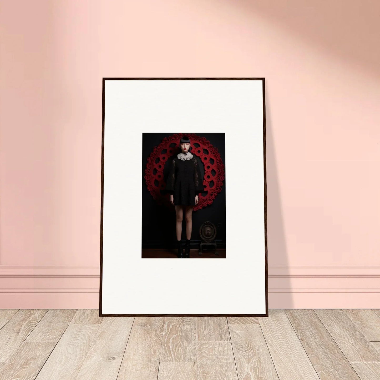 Framed wall art of a figure in black on red for Ecstasy Velvet Corsetry special edition