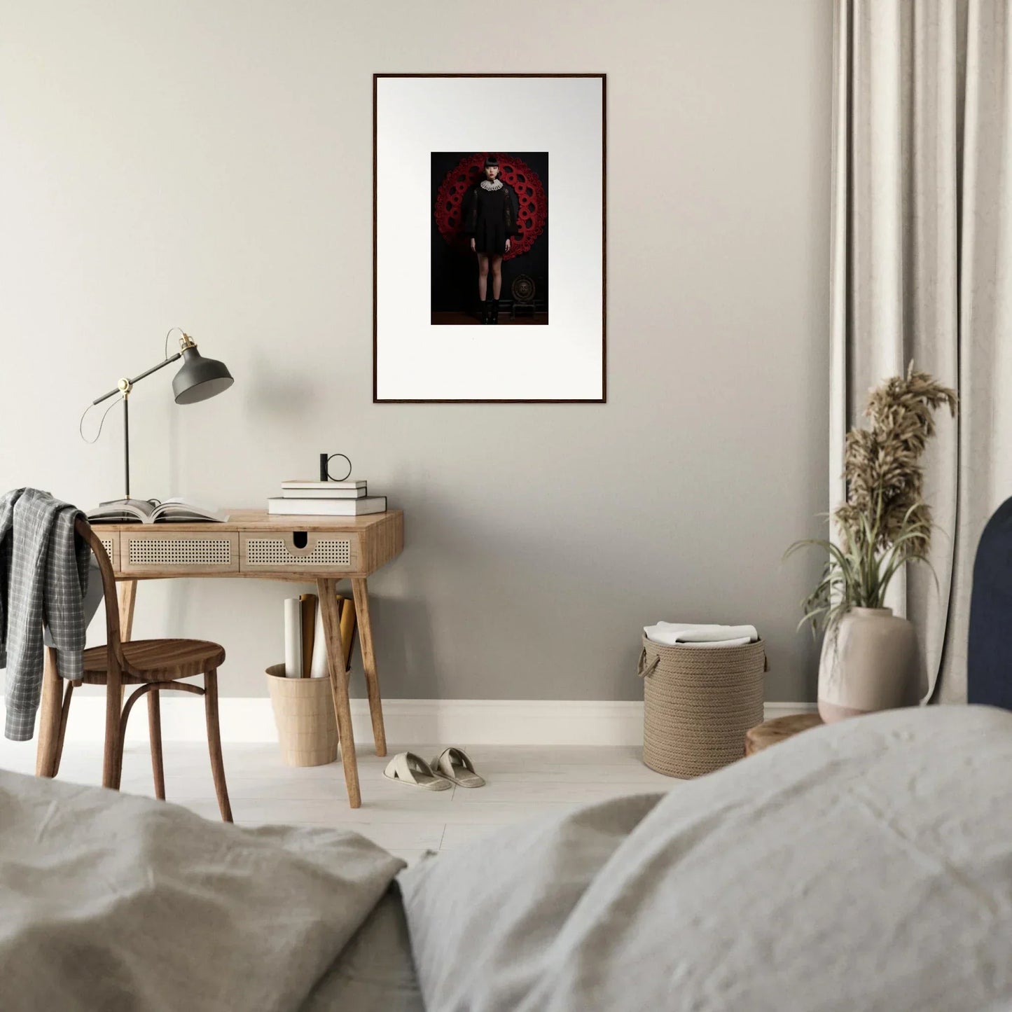 Minimalist bedroom workspace with wooden desk and task lamp, featuring Ecstasy Velvet Corsetry special edition art