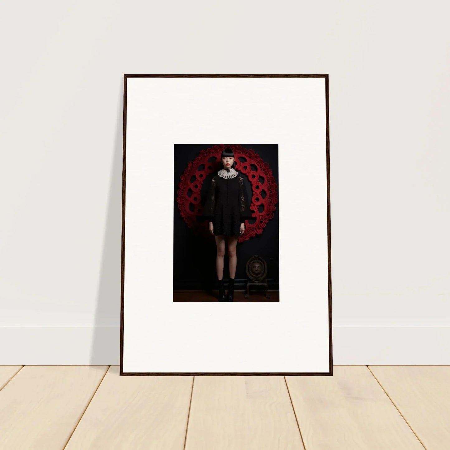 Framed wall art featuring dark figure on red background from Ecstasy Velvet Corsetry special edition