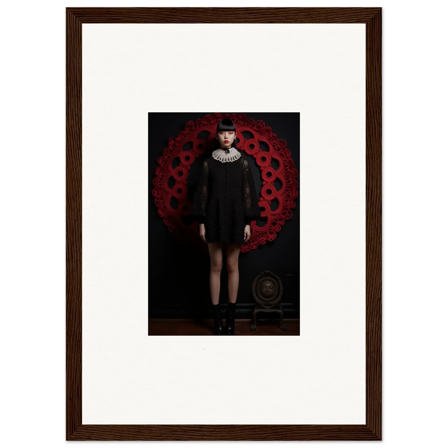 Framed wall art of a figure in a black dress with a white ruffled collar in Ecstasy