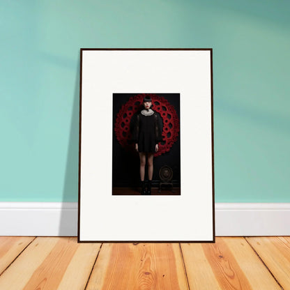 Framed wall art featuring a dark figure on a red background from Ecstasy Velvet Corsetry