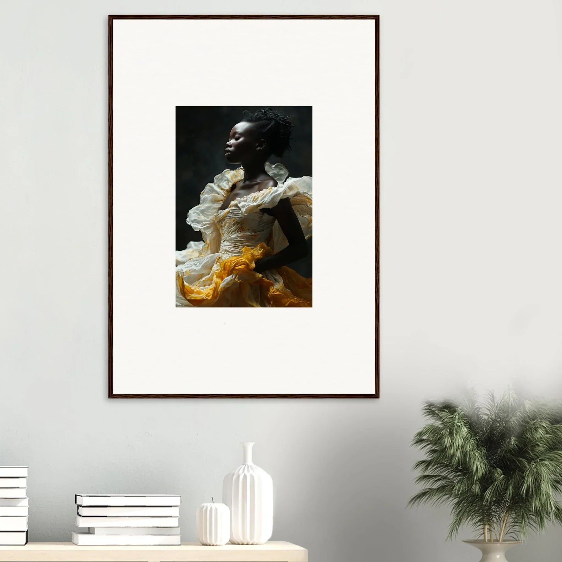 Framed wall art of a person in a yellow dress, part of Eclipsed Fluttering decor