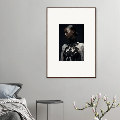 Framed wall art of person in white garment with dark floral patterns for stylish room decor