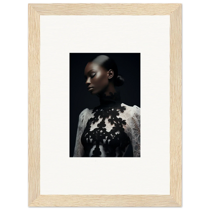 Framed wall art featuring a person in a white top with dark floral embellishments