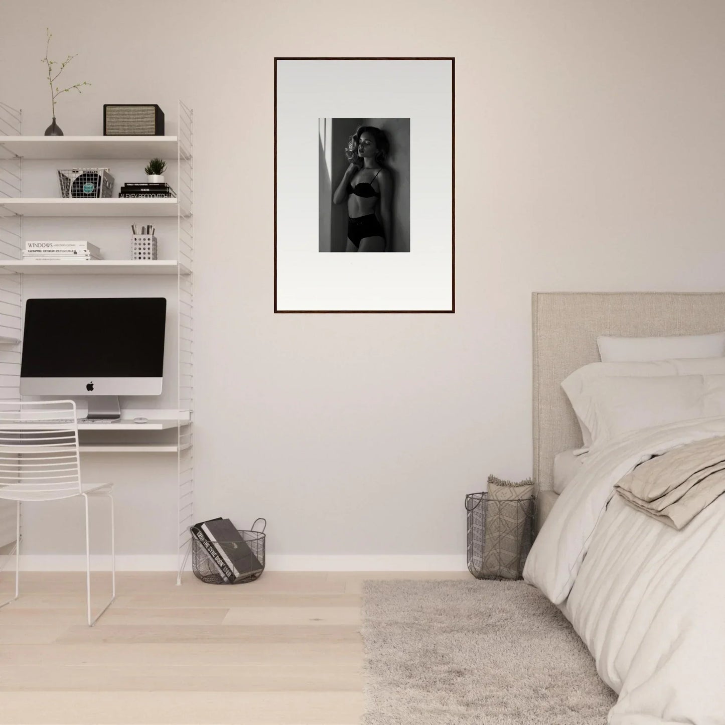 Minimalist bedroom with white walls, floating shelves, and a framed black and white photograph.