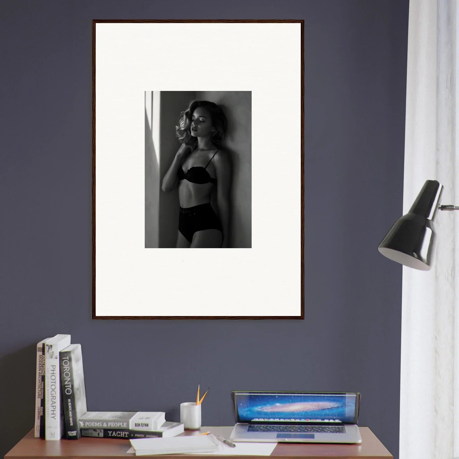 Framed black and white photograph of a woman in lingerie smoking a cigarette.