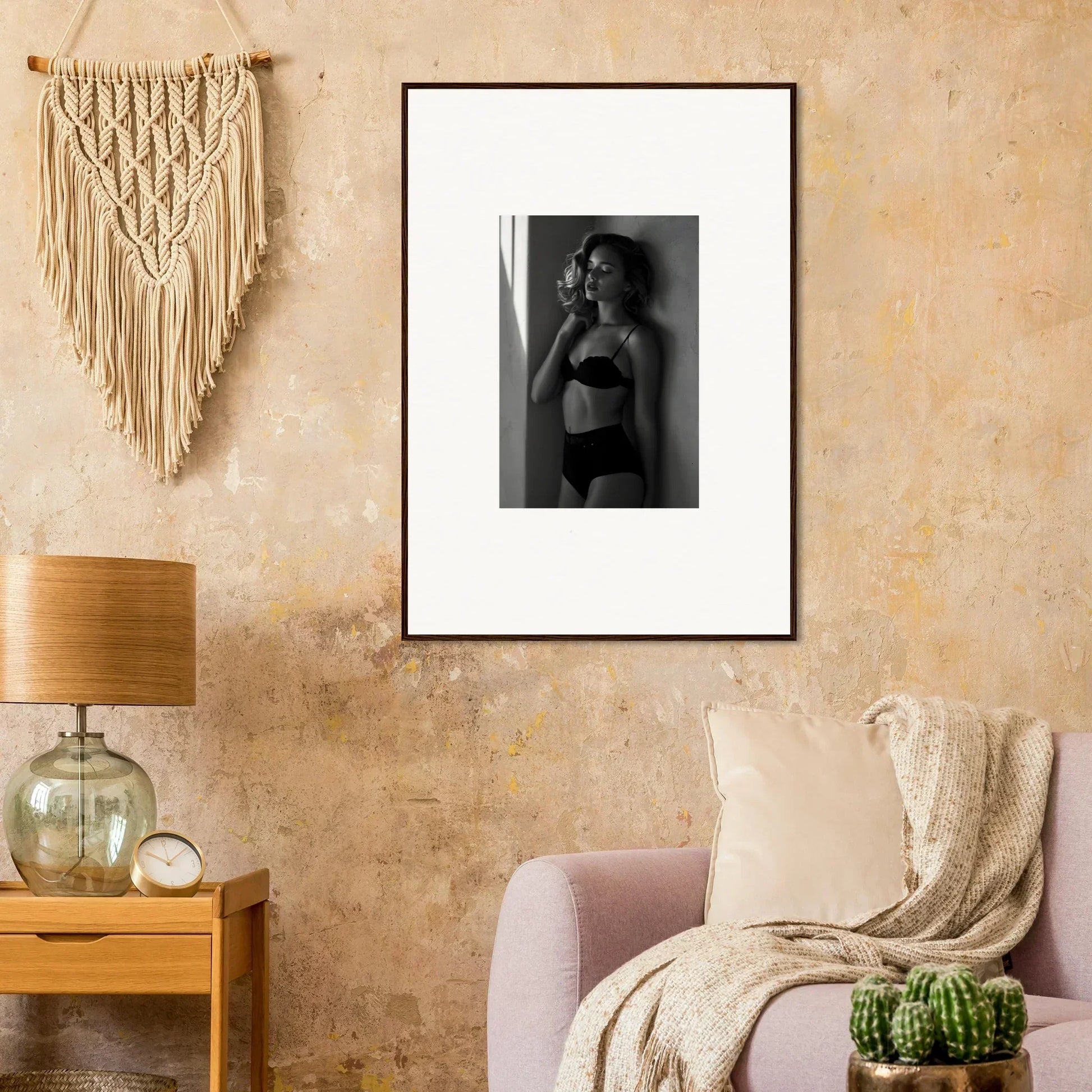 Framed black and white photograph of a woman in lingerie.