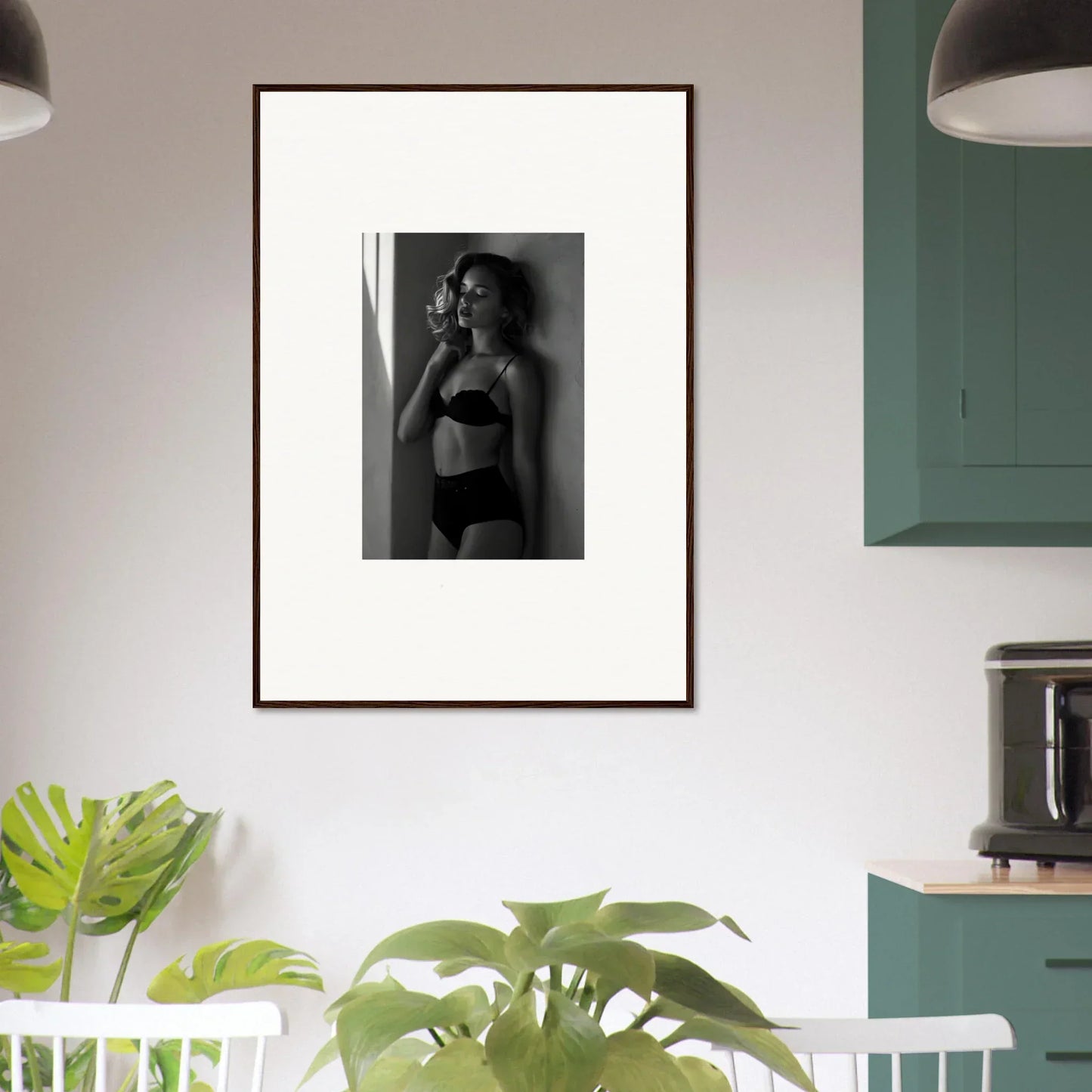 Framed black and white photograph of a woman in lingerie.