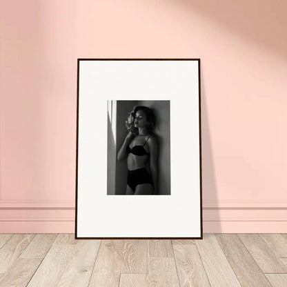 Framed black and white photograph of a person in lingerie.