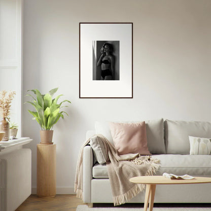 Framed black and white photograph of a woman in lingerie.