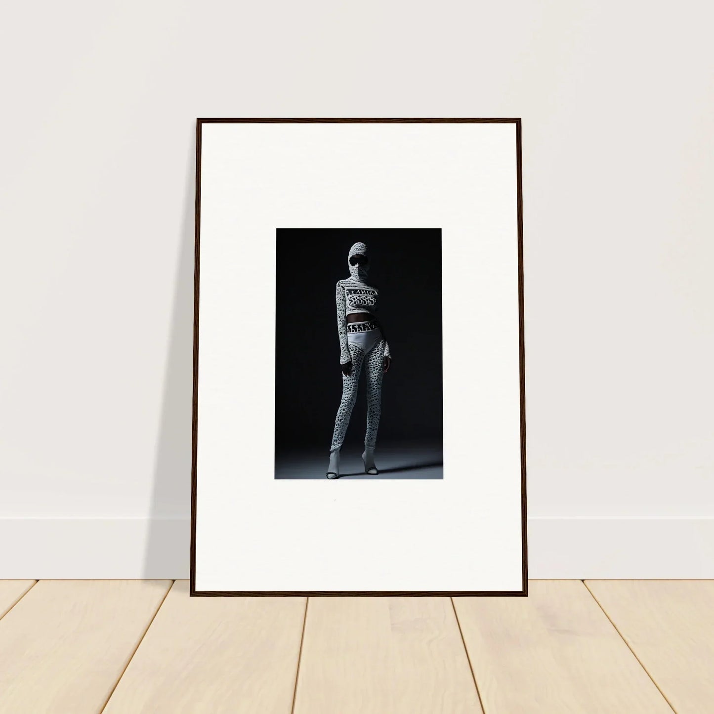 Framed black and white photograph of a person, perfect for Chic Mirage room decor