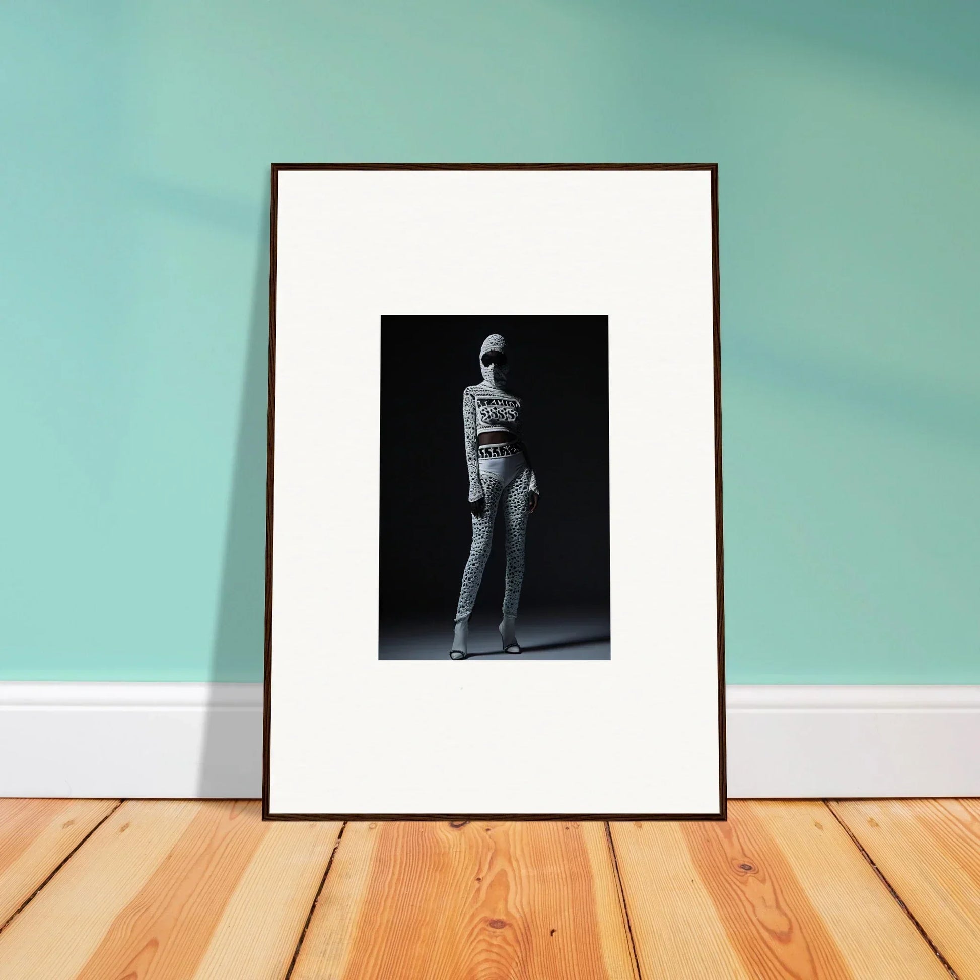 Framed black and white photograph of a person in a dramatic pose for chic mirage room decor