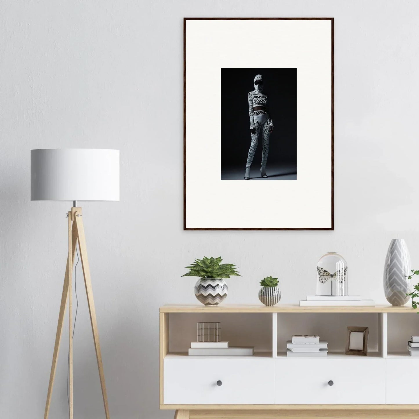 Framed black and white photograph of a person in a dramatic pose for chic mirage room decor