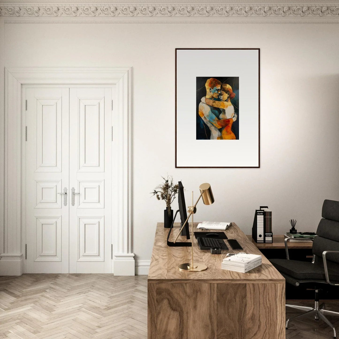 Home office workspace with wooden desk, chair, and Bondscreen Embrace wall art