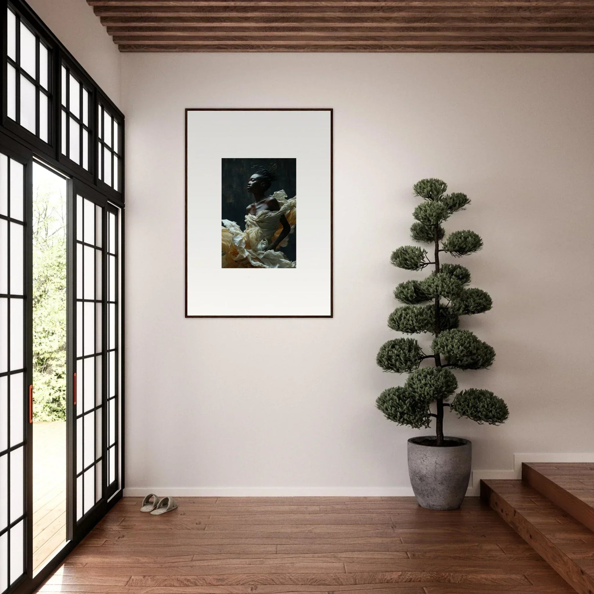 Framed black and white artwork hanging on a white wall.