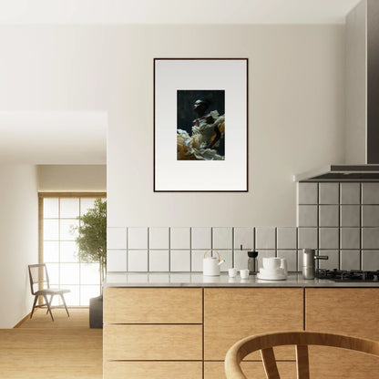 Modern kitchen with wooden cabinets, white tiled backsplash, and framed artwork on the wall.