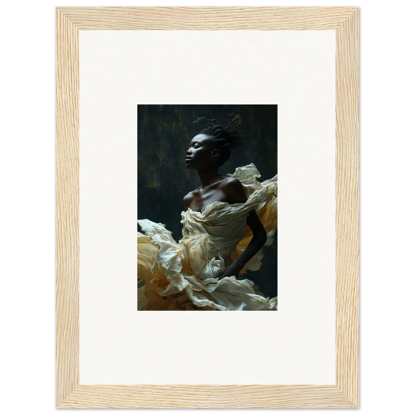 Framed photograph of a person emerging from billowing white fabric against a dark background.